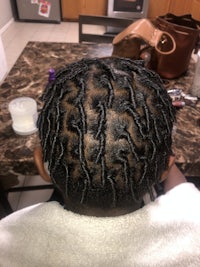 the back of a child's hair with dreadlocks