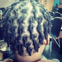 the back of a child's hair with twists in it