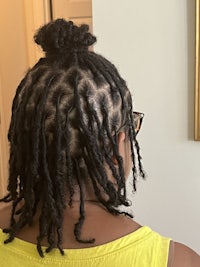 a woman with dreadlocks in her hair