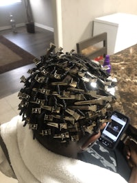 a woman is getting her hair done in a salon